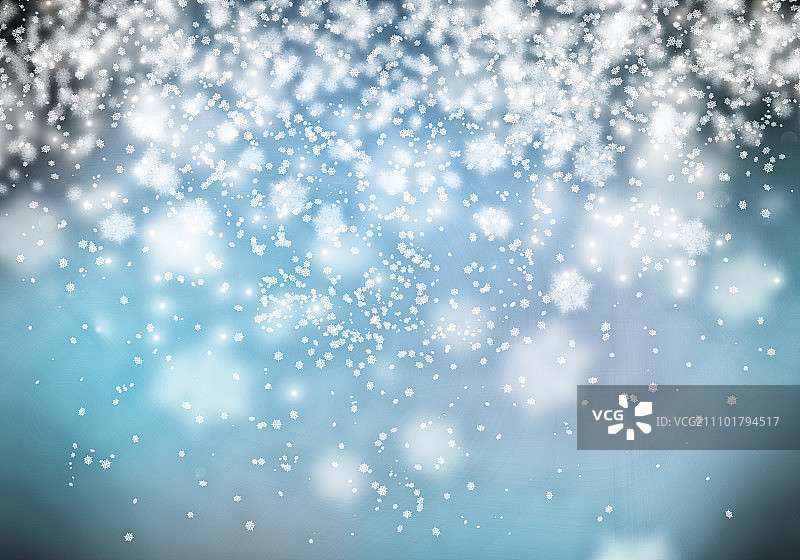 圣诞贺卡。概念图像与雪花在蓝色的背景图片素材
