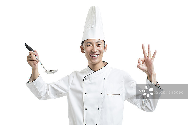 年轻厨师拿着长柄勺图片素材