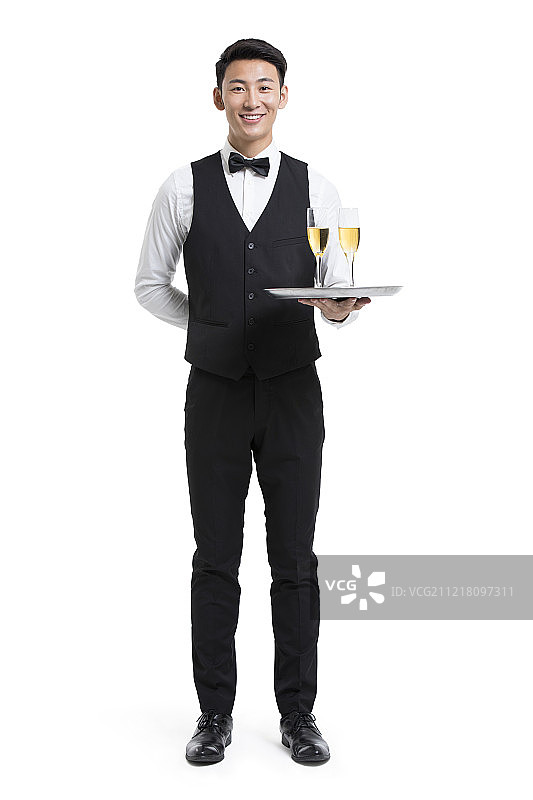 年轻服务员端着香槟图片素材