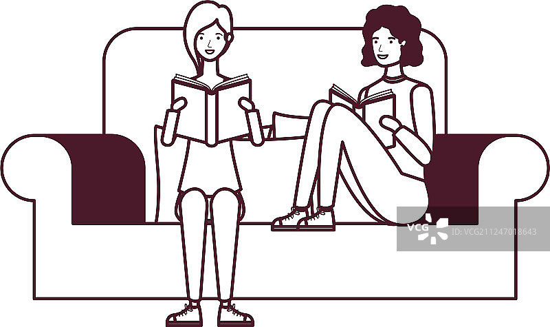 一对夫妇坐在椅子上，手里拿着书图片素材