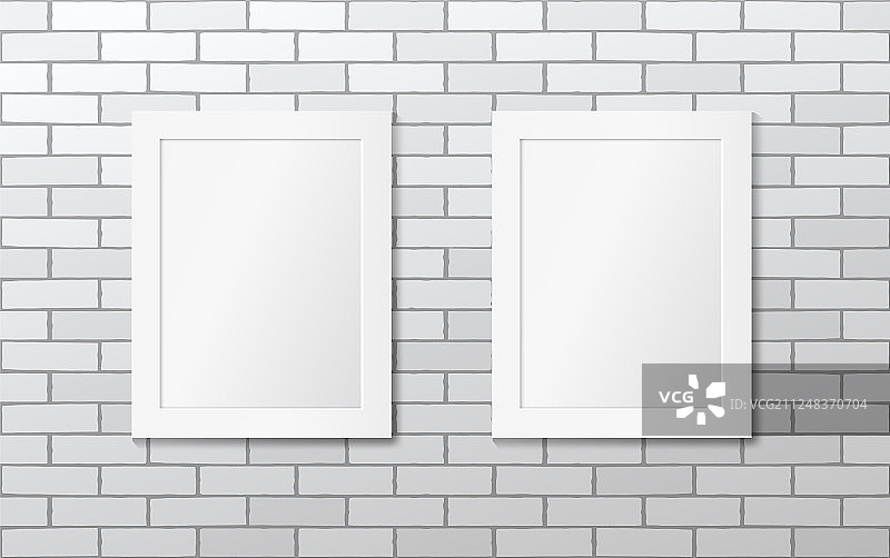 白色砖墙上挂着两个白色相框图片素材