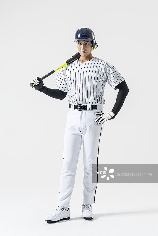 摄影的棒球运动员拿着棒球棒图片素材