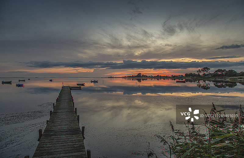 日落时的码头风景，斯莱尼斯，丹麦图片素材