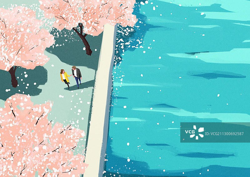一对情侣在樱花盛开的河边散步图片素材
