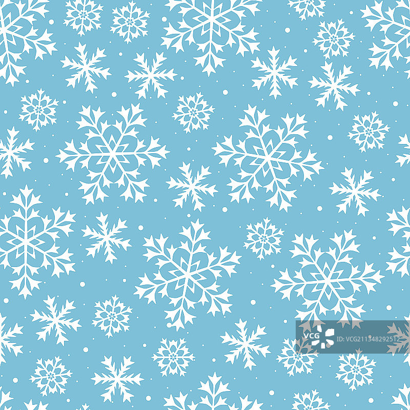 蓝色背景下的白色雪花圣诞图片素材