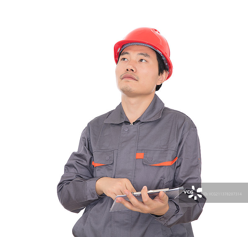 手拿文件资料头戴红色安全帽正在工作中的工人图片素材