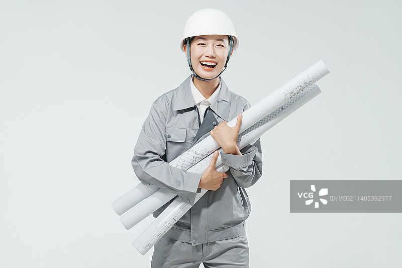 戴安全帽的快乐女工程师图片素材