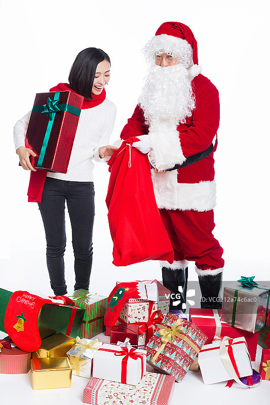 圣诞老人和青年女性手捧礼物盒图片素材