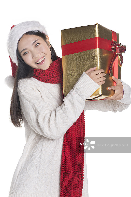 开心的女子拿着圣诞礼物图片素材