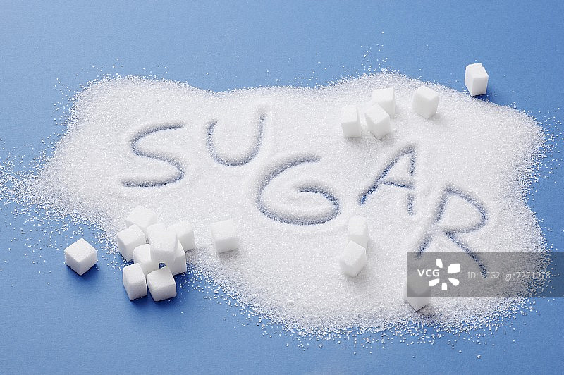 一堆糖，上面写着“糖”这个词图片素材