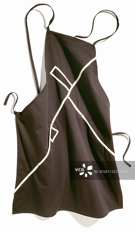 一个现代的黑色厨房围裙和白色的柄图片素材