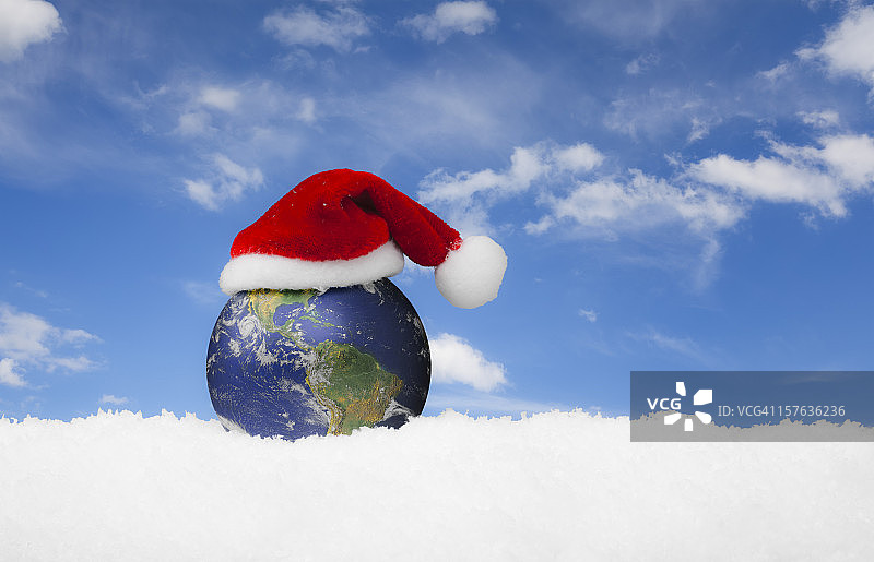 圣诞世界-圣诞老人帽在地球上图片素材