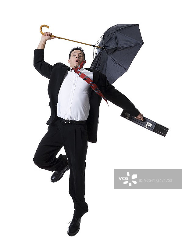 一个商人拿着伞跳跃的肖像图片素材