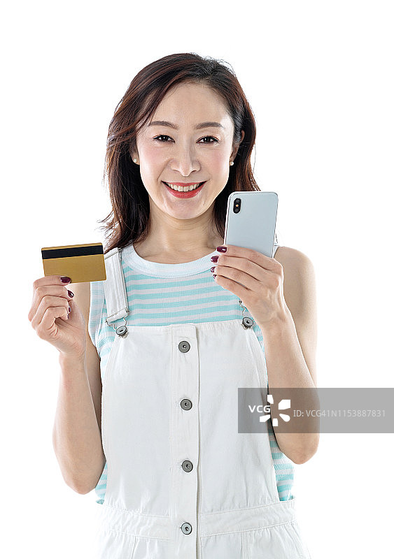 拿着手机和信用卡的女人图片素材