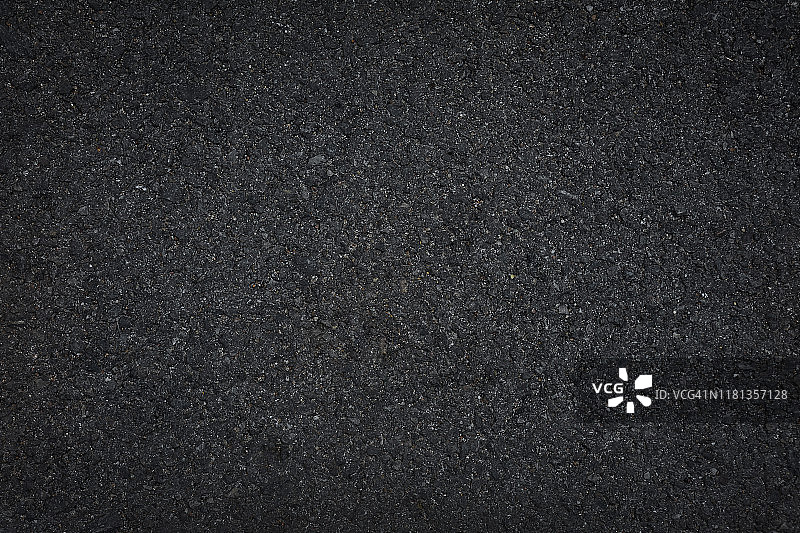 黑色沥青地板或路面纹理背景。图片素材
