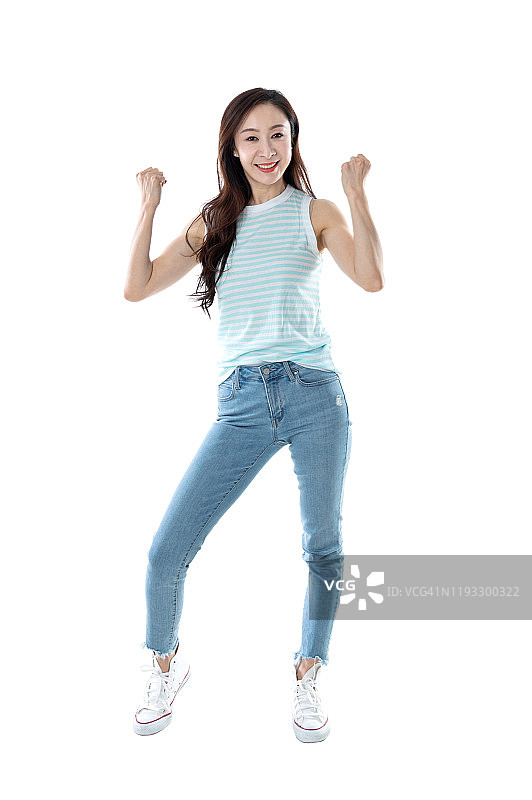 幸福的女人紧握拳头在白色的背景图片素材