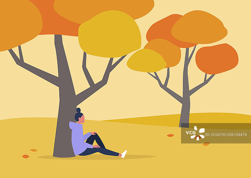 年轻女性人物坐在树下，秋日户外休闲，徒步旅行图片素材