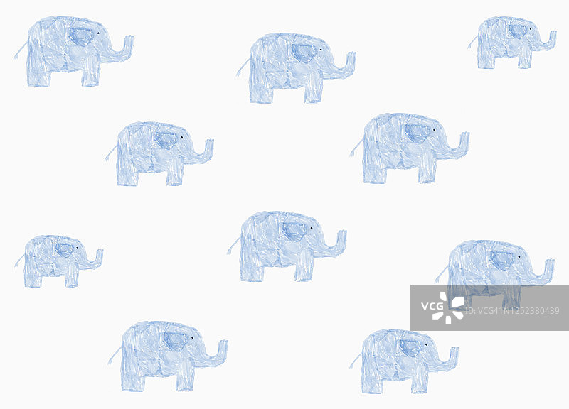 Childs在白色的背景上画蓝色的大象图案图片素材