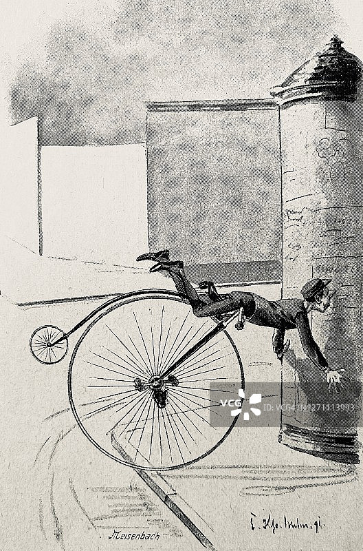 骑自行车的人摔倒在广告柱子上图片素材