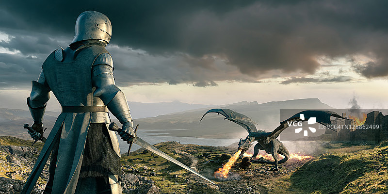 骑士俯视城堡附近喷火的巨龙图片素材