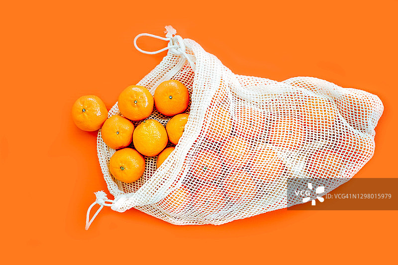 可重复使用的棉网袋小柑橘图片素材