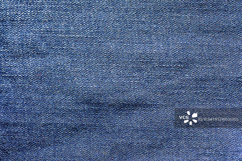 深蓝色牛仔裤纹理和纺织品背景。图片素材