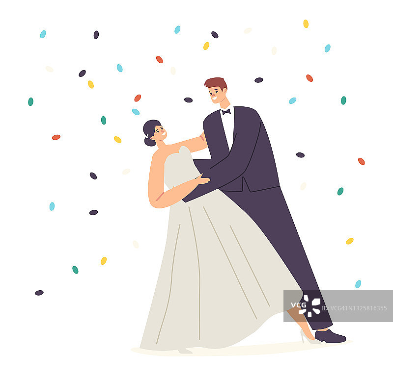 婚礼庆典，丈夫和妻子华尔兹下飘落的五彩纸屑。快乐的新婚夫妇表演舞蹈图片素材