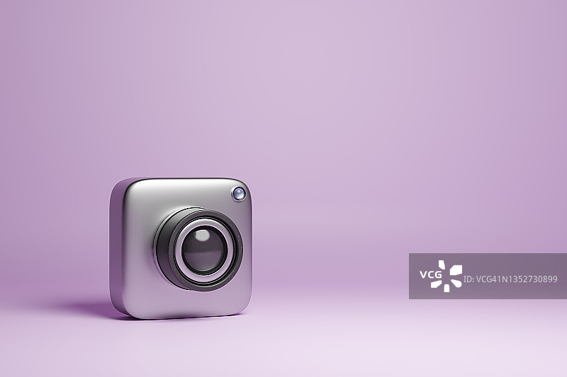 三维渲染的金属相机在紫色的背景图片素材