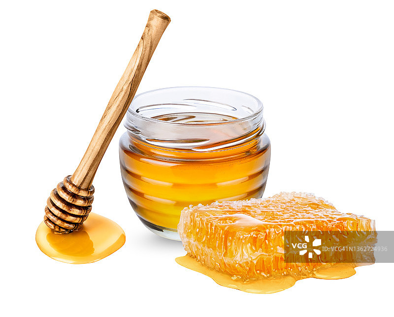 白色背景上的蜂蜜罐，蜂蜜罐和蜂蜜勺图片素材