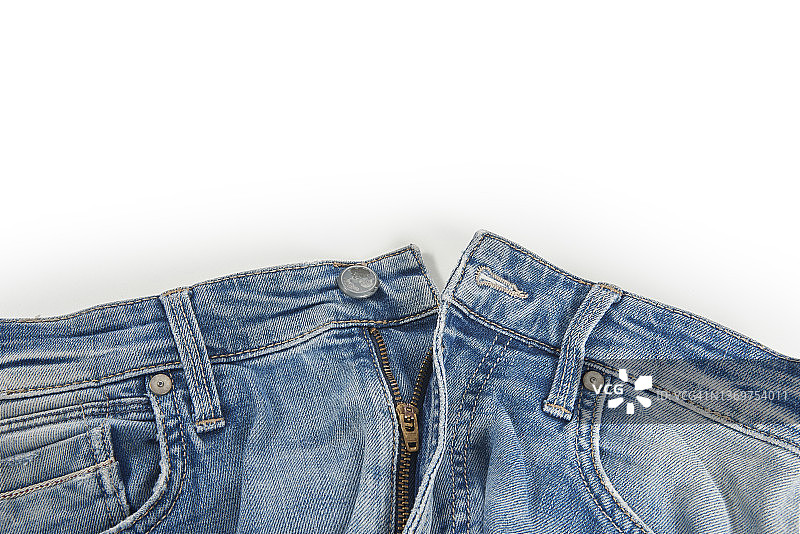 蓝色牛仔裤纽扣孤立在白色背景，折叠，时尚，时尚的牛仔布。图片素材