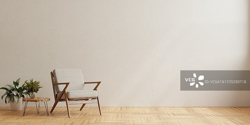 灰色扶手椅的室内空白色墙壁背景。图片素材