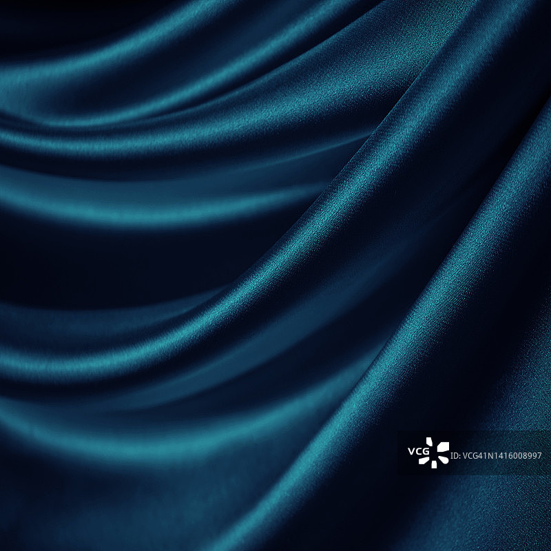 黑蓝缎子。窗帘。特写镜头。豪华背景设计。柔软的褶皱。波浪叶。图片素材