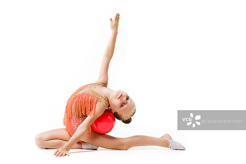 灵活的体操女孩弯曲与球图片素材