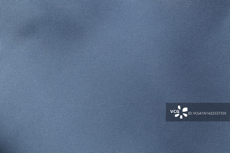 蓝色面料，涤纶面料质地，纺织背景。图片素材