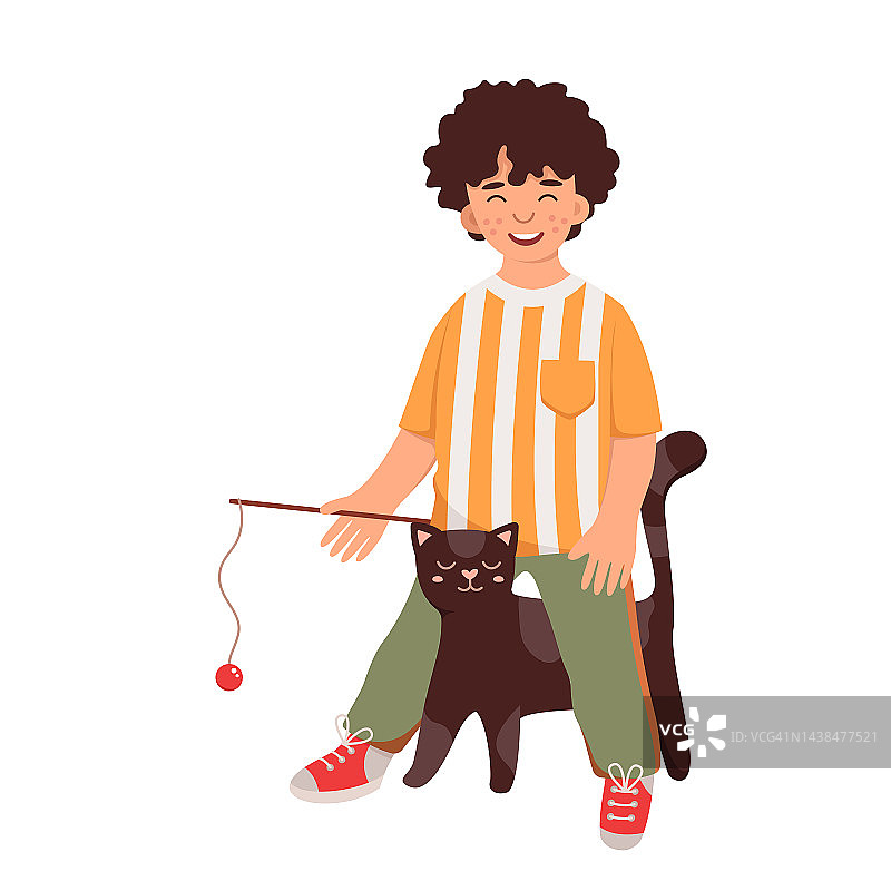 快乐的男孩和他的猫玩耍图片素材