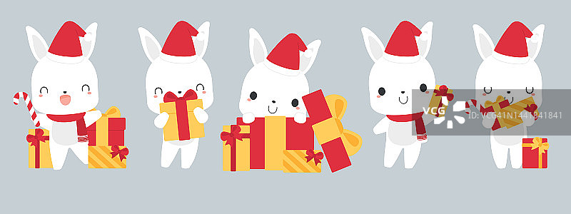 一套可爱的白色兔子卡通人物戴着圣诞老人的帽子，拿着礼盒。节日的圣诞假期概念。图片素材