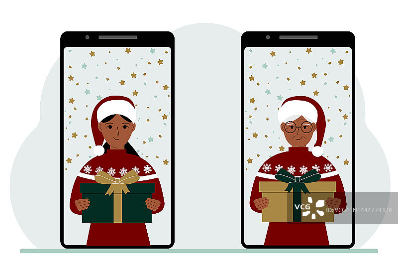 一名女子和另一名女子通过手机视频会议在网上见面，虚拟讨论圣诞和新年假期和礼物。图片素材