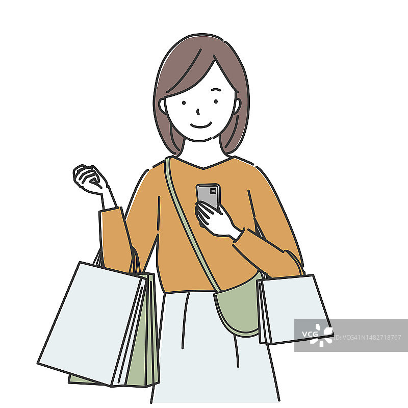 年轻女子拿着智能手机和购物袋图片素材