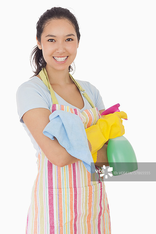 快乐的女人拿着清洁产品图片素材
