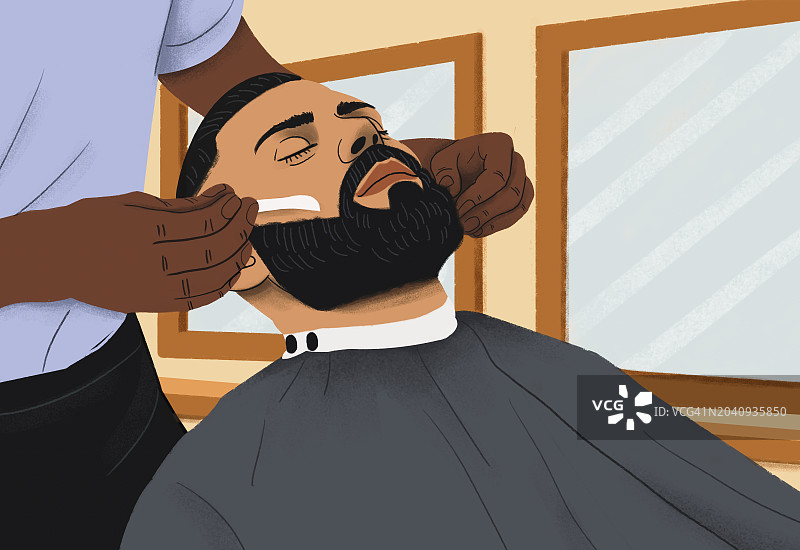 男子在理发店接受理发师剃须图片素材