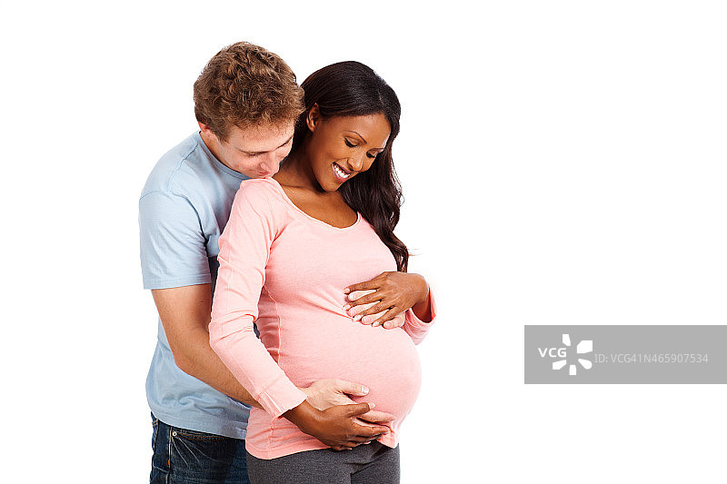 未来的父母感觉胎儿运动。图片素材