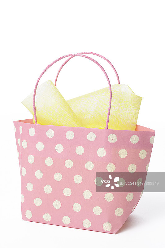 白色背景装饰的粉色小购物袋图片素材