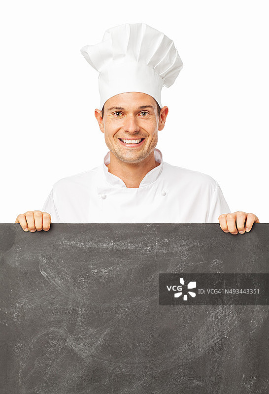 厨师拿着空白的黑板在白色的背景图片素材