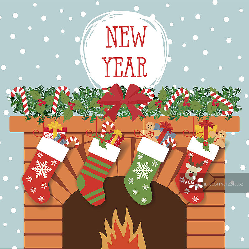 壁炉的背景是圣诞袜和礼物图片素材