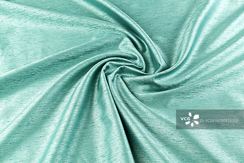 绿松石背景豪华布料或波浪褶皱的垃圾丝绸质地缎子图片素材