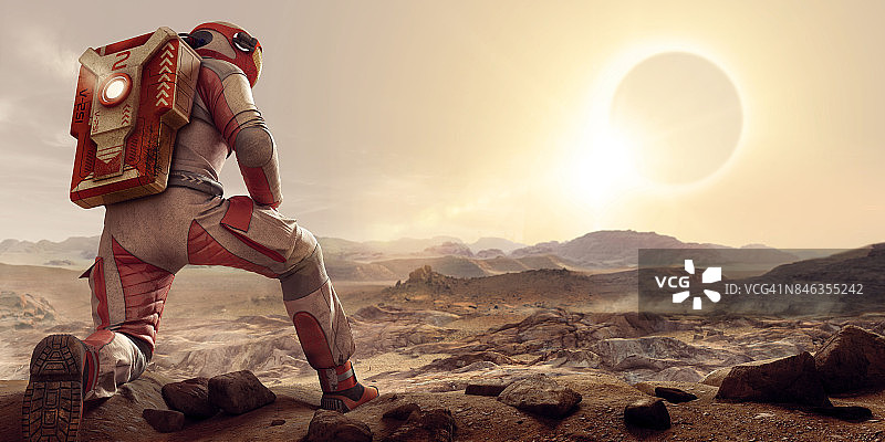宇航员在火星上跪着看日落图片素材