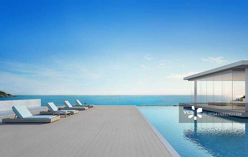 现代设计的豪华海滨别墅海景游泳池和露台，度假别墅或酒店木地板甲板上的躺椅-现代度假别墅外观的3d插图图片素材