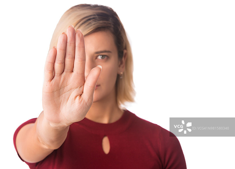 停止手，女人的手势，歧视或反暴力的符号孤立在白色图片素材