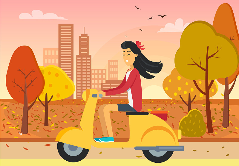 一个女人在秋天的城市公园里开着踏板车图片素材