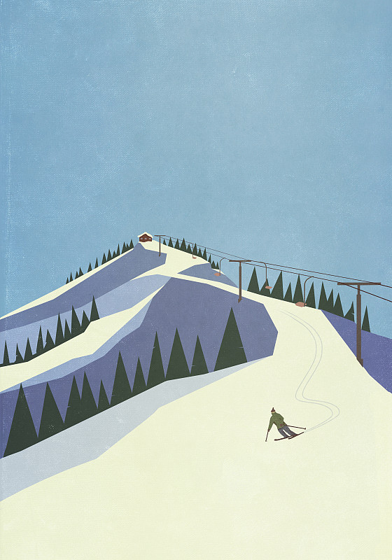 滑雪者从多雪的山坡下行图片素材